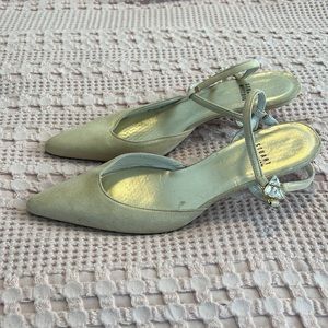 Stuart Weitzman kitten heel pumps with jewel buckle.
